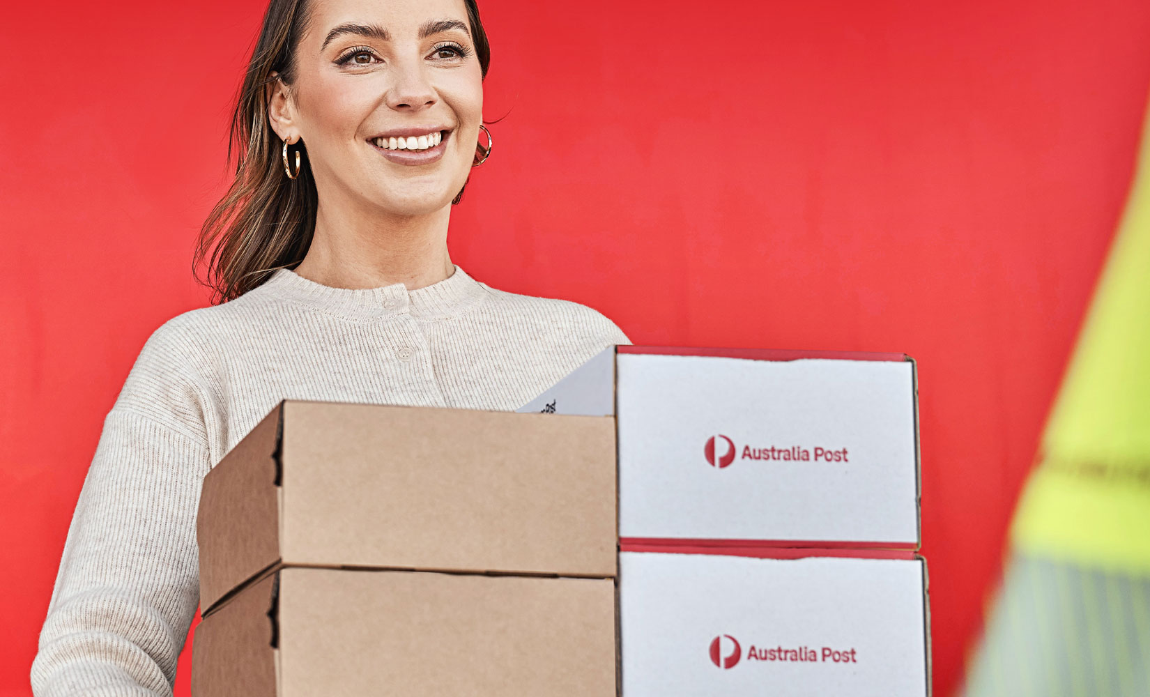 Female holding Australia post deliveries